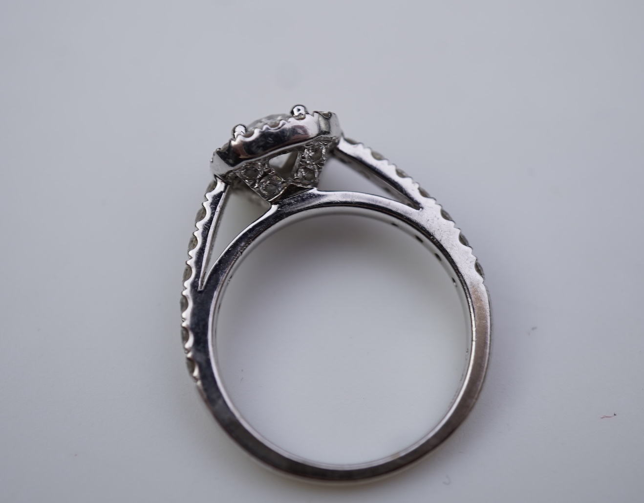 A diamond engagement ring and half eternity ring